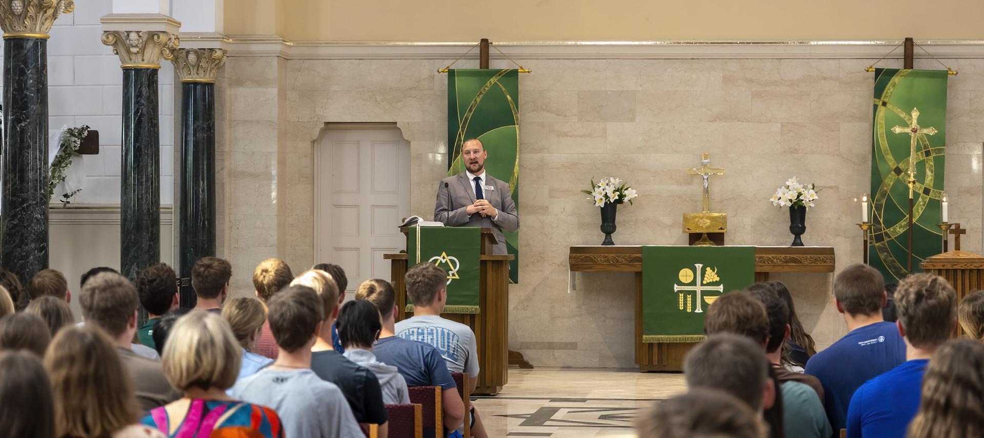 Pastor leading chapel service